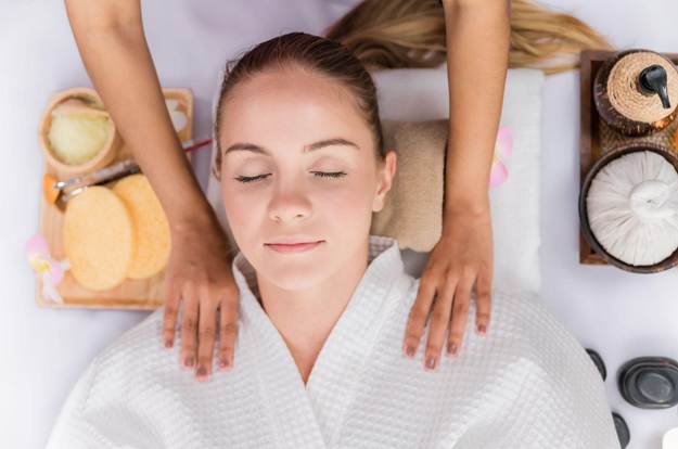 Tranquil spa treatment room with natural exfoliating scrubs and aromatic oils